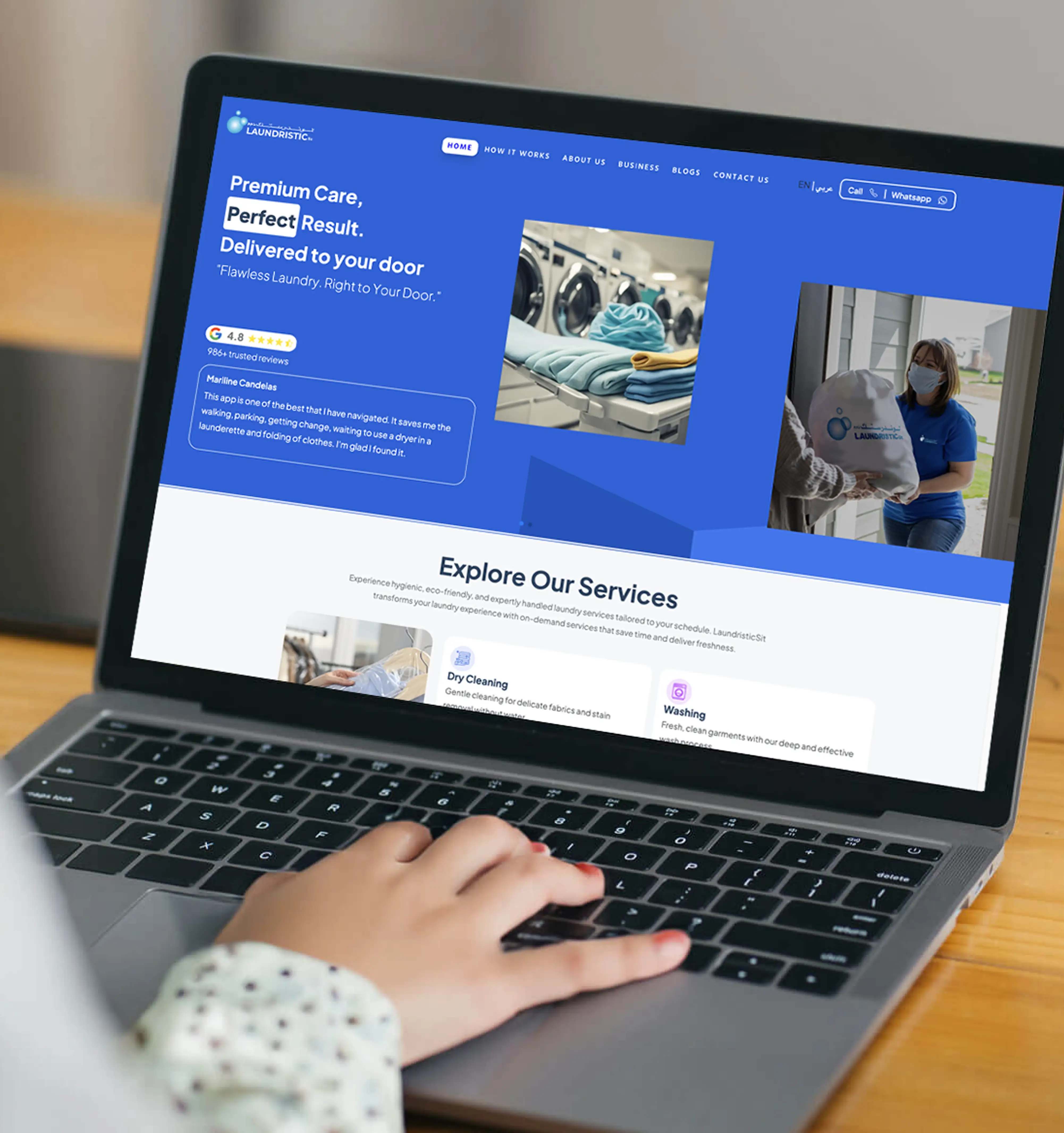 a person checking laundristic website in his laptop